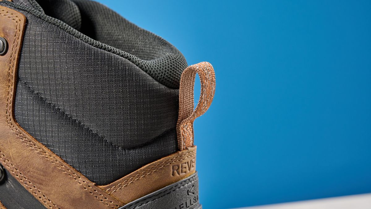The Keen Revel IV ankle loop against a blue background