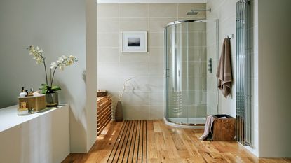 A bathroom with shower and underfloor heating