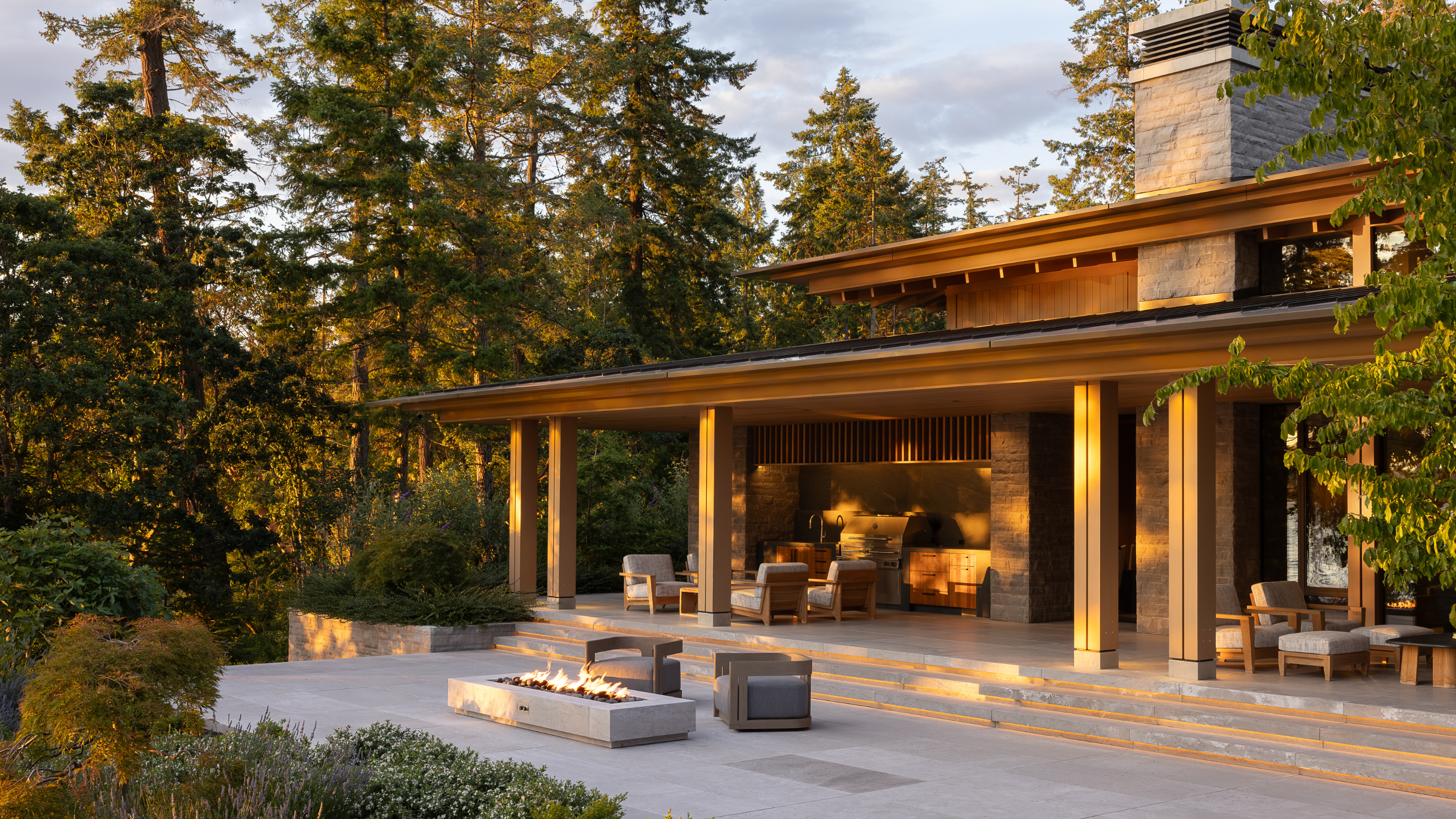 beautiful outdoor space set amongst the forest with fire pits and outdoor seating