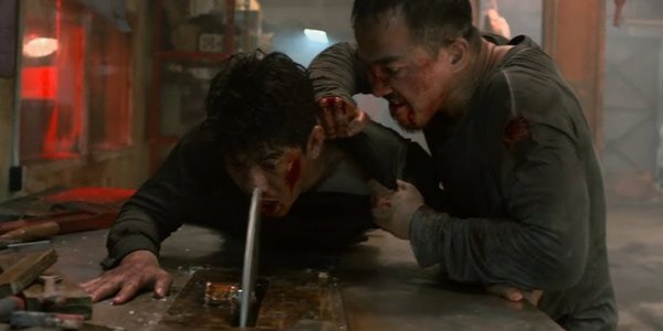 Joe Taslim pushing Iko Uwais into a buzz saw The Night Comes For Us