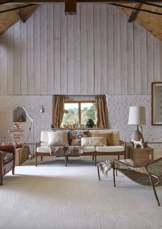 rustic living room with vaulted ceiling wall panelling