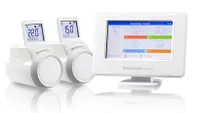 The Honeywell EvoHome smart thermostat and two radiator valves on a white background