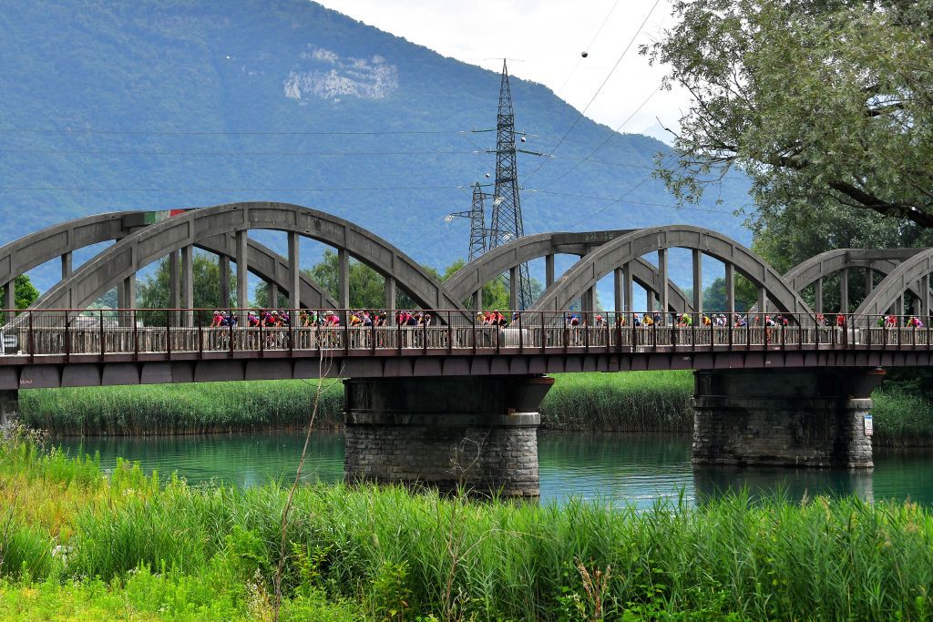 COLICO ITALY JULY 07 The Peloton passing through a Bridge during the 32nd Giro dItalia Internazionale Femminile 2021 Stage 6 a 155km stage from Colico to Colico Landscape GiroDonne UCIWWT on July 07 2021 in Colico Italy Photo by Luc ClaessenGetty Images