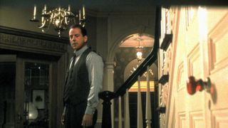 Bruce Willis looks at a closed door in The Sixth Sense