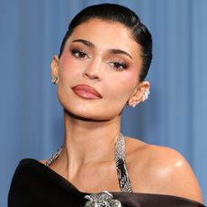 Kylie jenner wears a halter dress to the 2025 met gala.