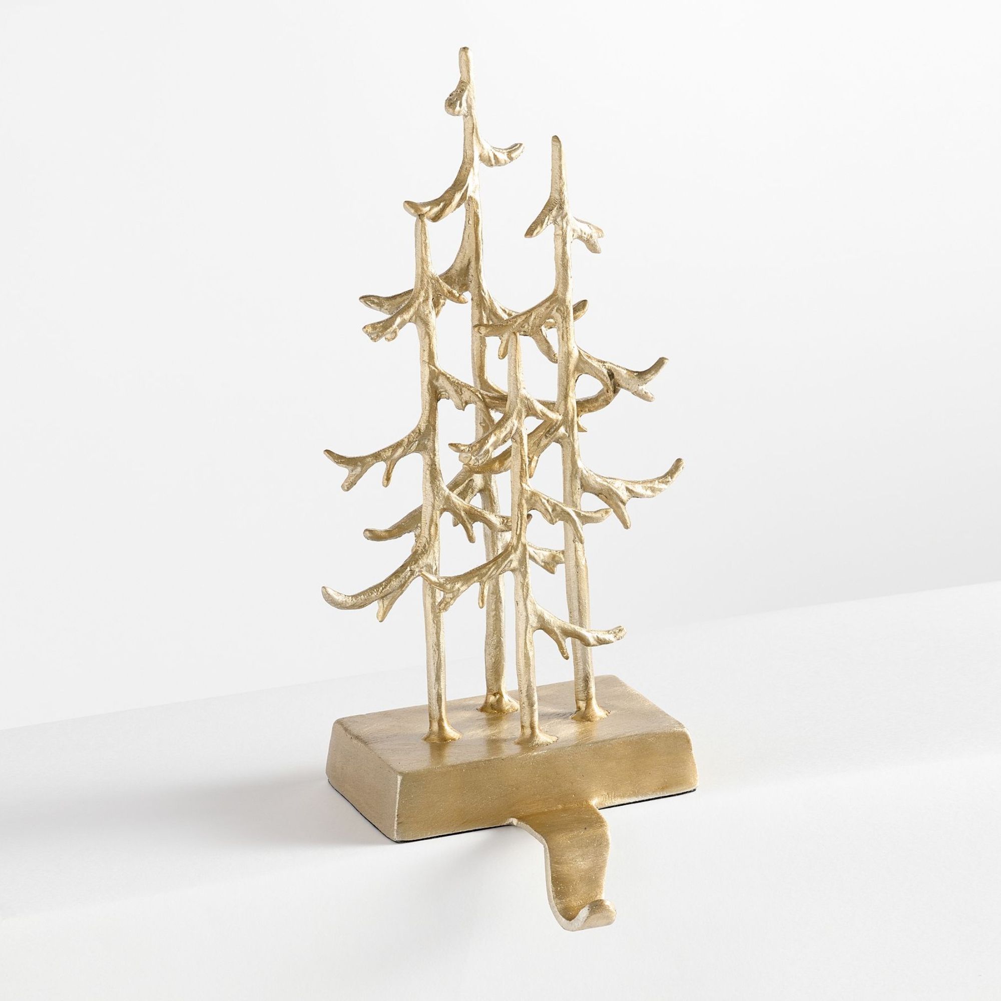 Gold stocking holder with three Christmas trees