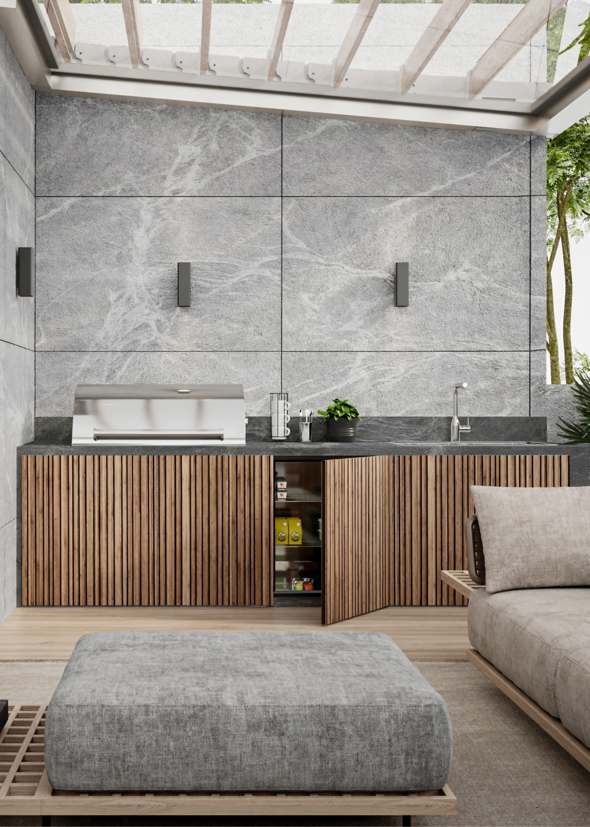 A semi-outdoor space with a seating, and a grill set up in the corner of the room