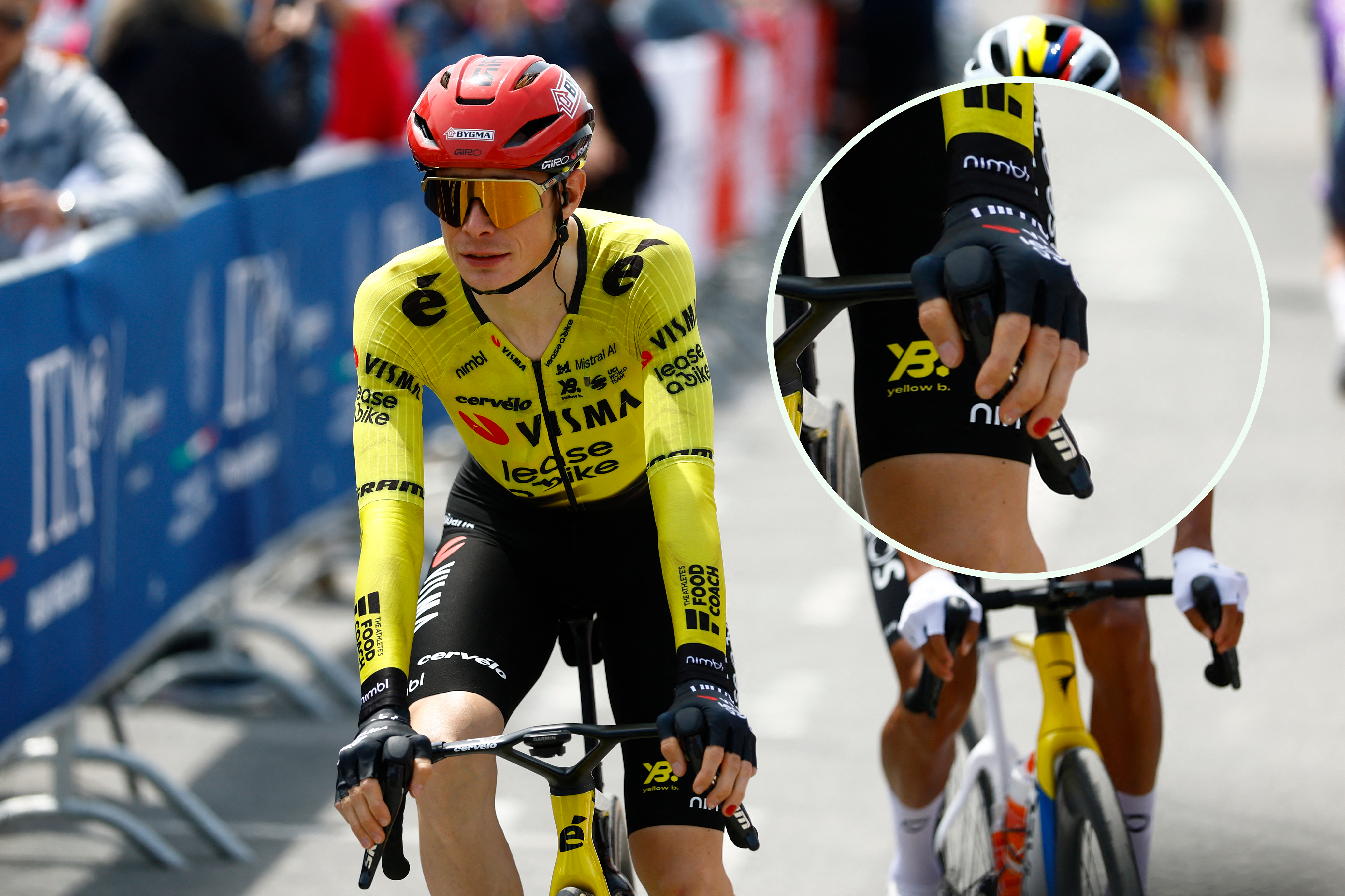 An image showing Jonas Vingegaard riding to the start of stage 1 of the Giro d'Italia with one fingernail painted red