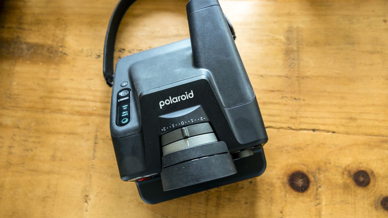 The Polaroid I-2 on a wooden table