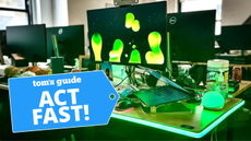 Govee RGBIC LED Neon Rope Light wrapped around work desk and lighting up green with Act Fast badge