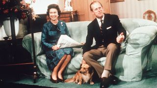 Queen Elizabeth II and Prince Philip, Duke of Edinburgh relax with their corgis
