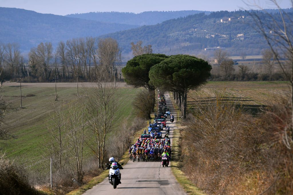 SIENA ITALY MARCH 05 A general view of the peloton passing through a landscape during the Eroica 8th Strade Bianche 2022 Womens Elite a 136km one day race from Siena to Siena Piazza del Campo 321m StradeBianche on March 05 2022 in Siena Italy Photo by Luc ClaessenGetty Images
