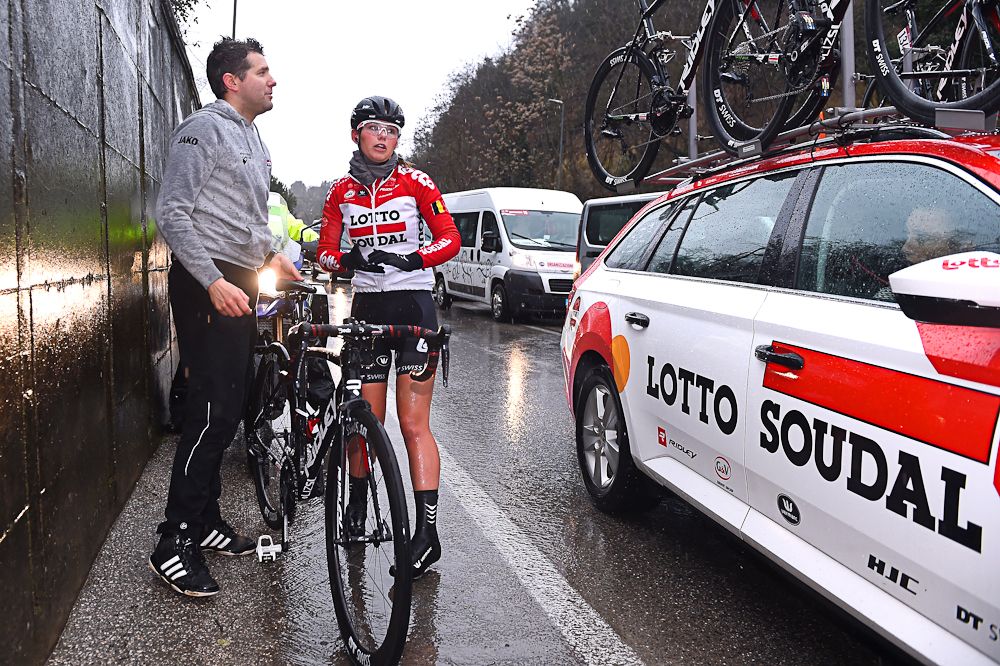 Puck Moonen waits for assistance alongside the route of Strade Bianche