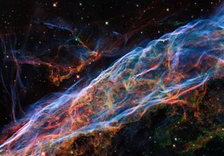 This Hubble Space Telescope image of the Veil Nebula is seriously one to behold. While this is an older photo, new processing techniques have more recently been applied to the image to bring out even more detail and highlight the absolute brilliance of this sight. The Veil Nebula can be found about 2,100 light-years from Earth, nestled in the constellation Cygnus (The Swan), and in this photo you can see just a piece of the magnificent, expansive nebula.