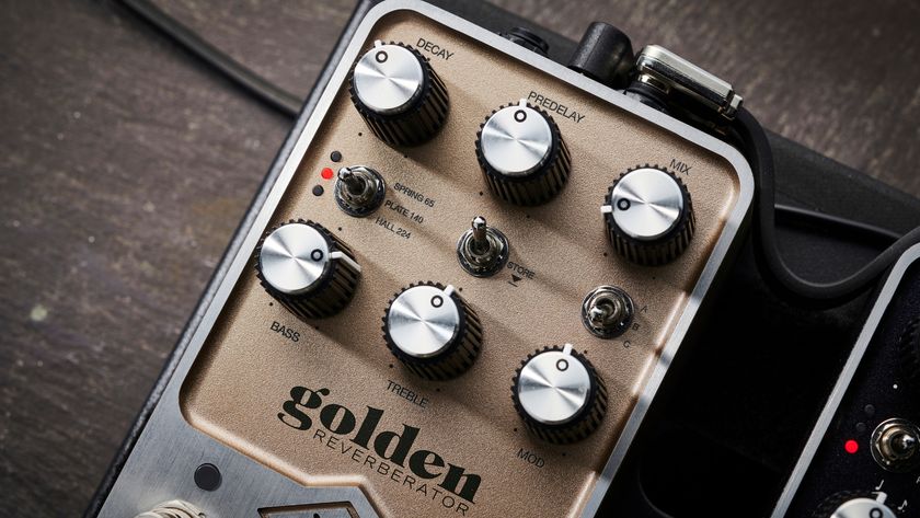Close up of the controls on a Universal Audio UAFX Golden Reverberator reverb pedal, lying on a wooden floor