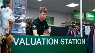 A member of staff at the Golf Clubs 4 Cash valuation station