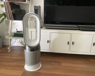 Dyson Pure Hot + Cool HP04 in living room with white TV unit and leaning ladder
