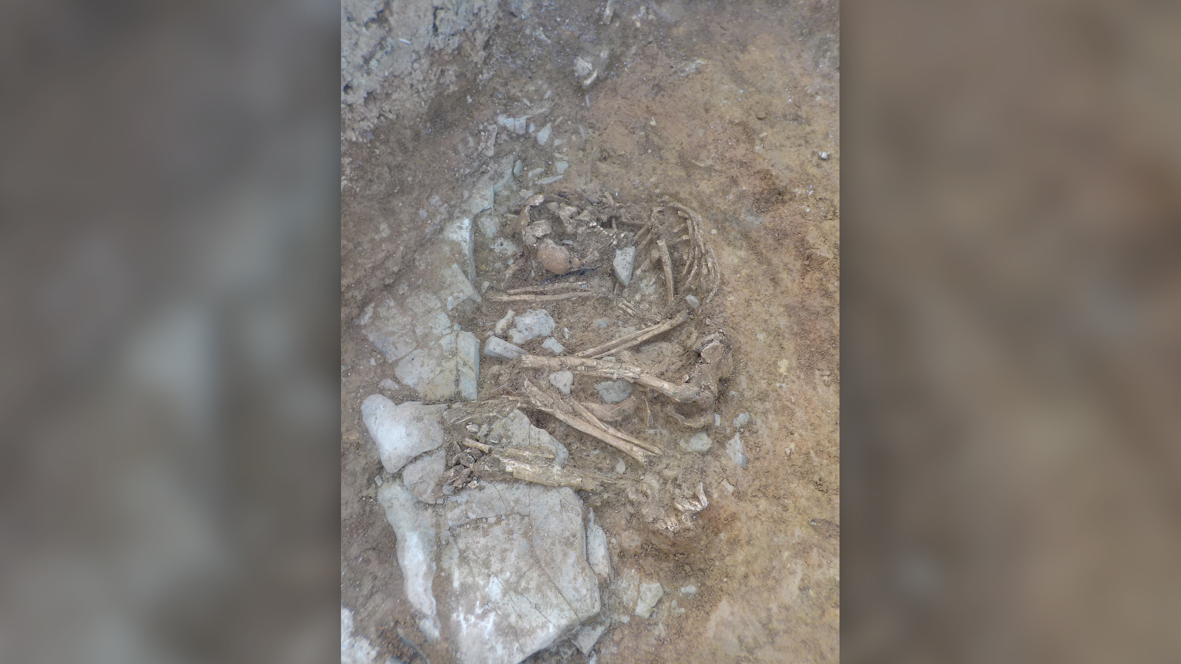 A late Bronze Age crouch burial in the base of the monument.