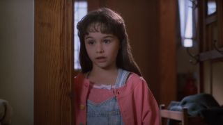 Danielle Harris as Jamie Lloyd standing in a doorway in Halloween 4: The Return of Michael Myers