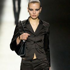 Woman in cropped, fitted blazer