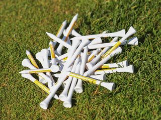white Pride Professional Golf Tees Large Pack tees on grass