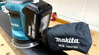 Rear view of Makita DBO180 orbit sander with dust extraction bag