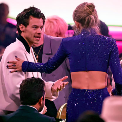 Harry Styles and Taylor Swift speak during the 65th GRAMMY Awards at Crypto.com Arena on February 05, 2023 in Los Angeles, California.