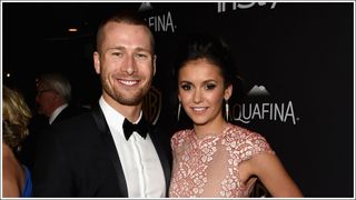 Actors Glen Powell (L) and Nina Dobrev smile as they attend The 2016 InStyle And Warner Bros. 73rd Annual Golden Globe Awards Post-Party at The Beverly Hilton Hotel on January 10, 2016 in Beverly Hills, California.