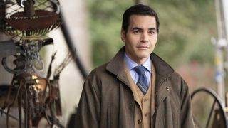 Ramón Rodríguez as Will Trent in a brown coat in Will Trent season 2 