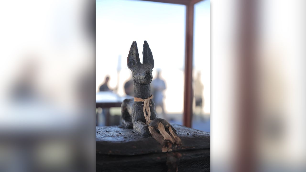 A sculpture depicting Anubis, a god associated with funerary events and the underworld. It is one of the discoveries made in the newly found cemetery.