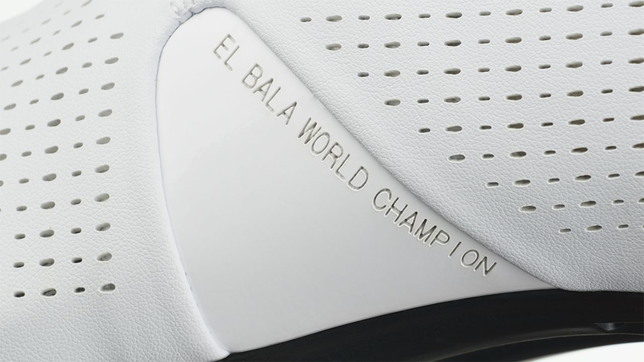 The instep of the shoe has the inscription "El Bala World Champion"