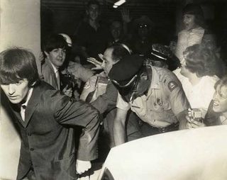 The Beatles under siege, leaving their hotel