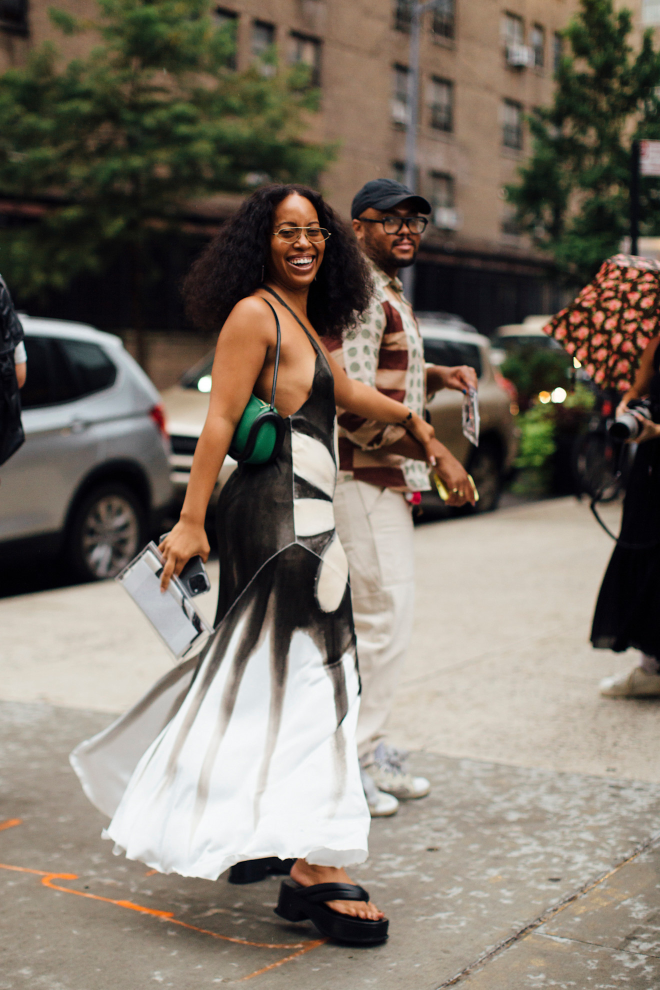 woman wearing a floral dress and platform sandals in New York City .