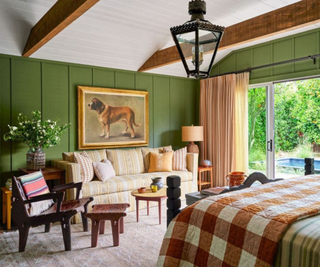 green paneled bedroom with western interior design accents and textiles