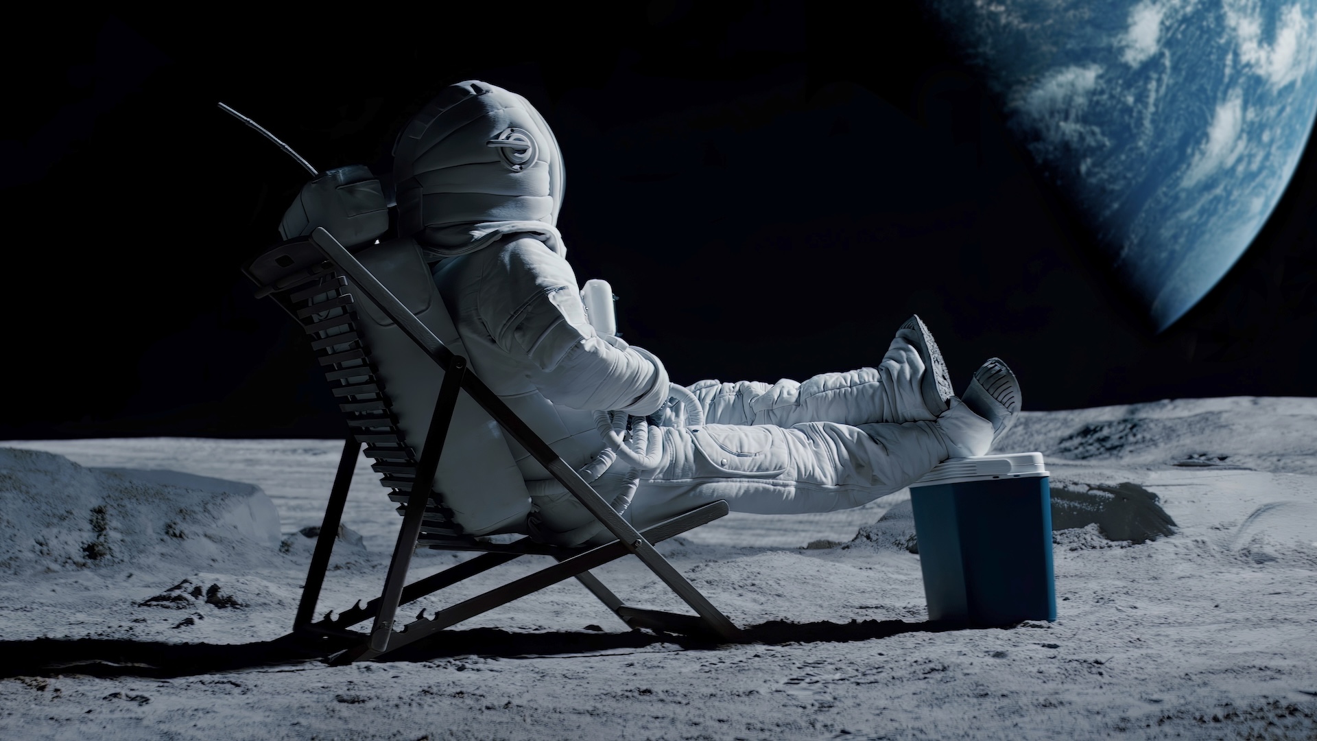 An illustration of an astronaut sitting in a lounge chair on the moon