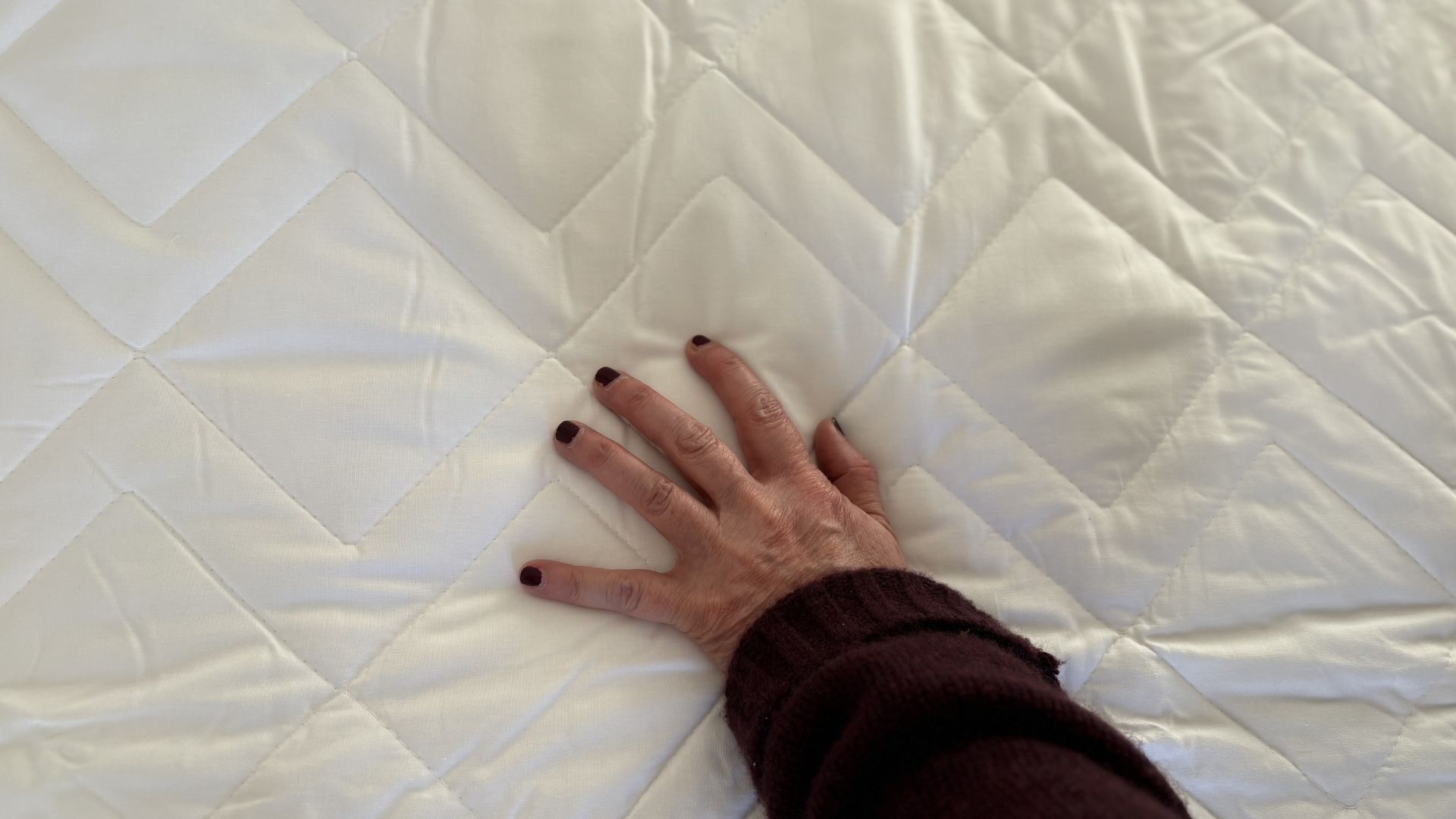 Simba Performance Mattress Protector being tested, on the bed