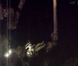 Luca Parmitano attached to space station's robotic arm
