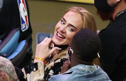 PHOENIX, ARIZONA - JULY 17: Singer Adele smiles with Rich Paul during the second half in Game Five of the NBA Finals between the Milwaukee Bucks and the Phoenix Suns at Footprint Center on July 17, 2021 in Phoenix, Arizona. NOTE TO USER: User expressly acknowledges and agrees that, by downloading and or using this photograph, User is consenting to the terms and conditions of the Getty Images License Agreement. (Photo by Ronald Martinez/Getty Images)