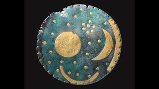 A photograph of the Nebra Disc, one of the earliest known artefacts depicting the night sky.