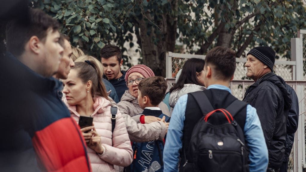 Worried parents at School No. 88 in Izhevsk, Russia.