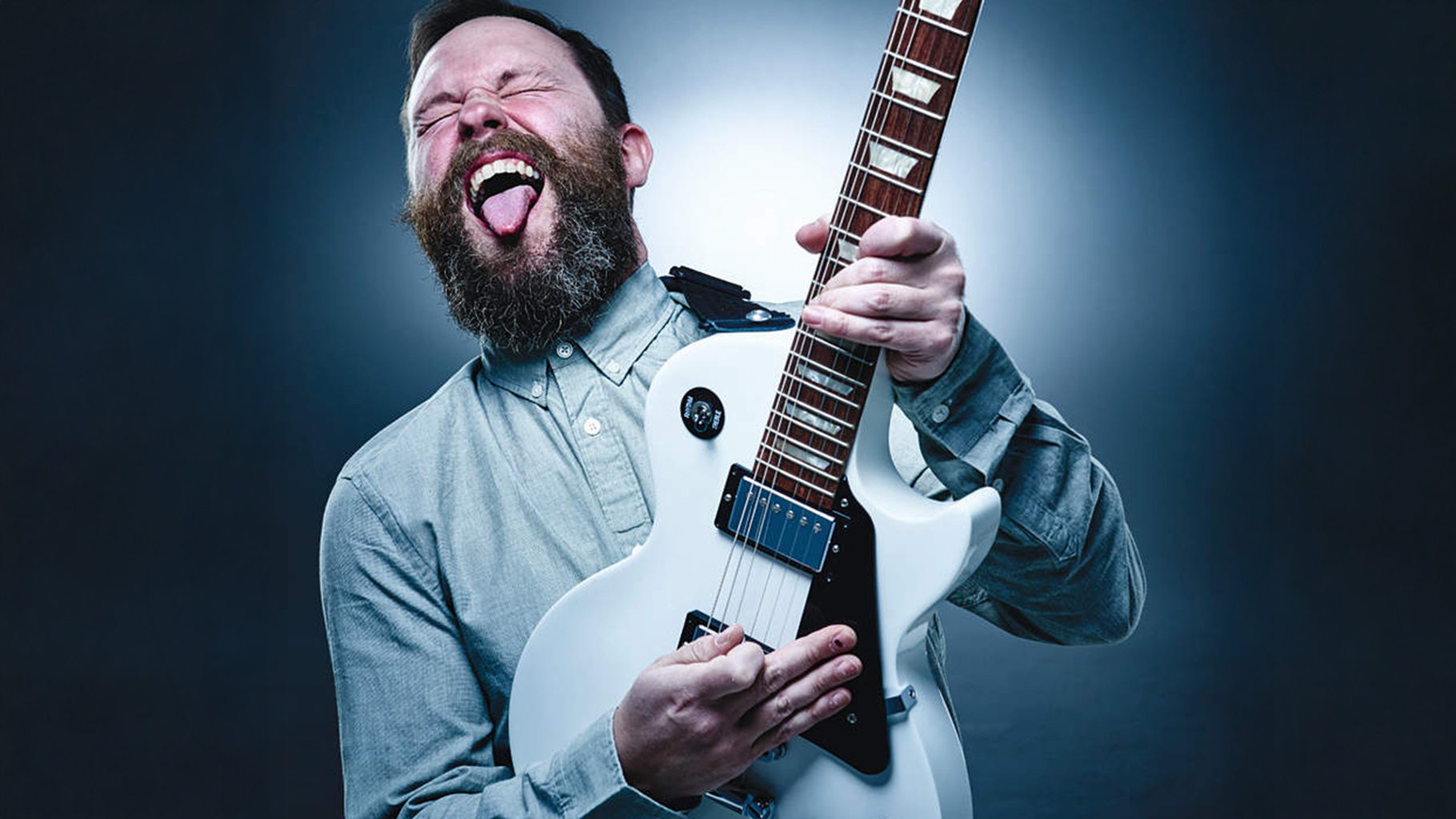 Man playing Epiphone Les Paul Studio