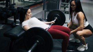 Woman performs barbell hip thrust