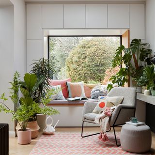 white living room with couch and potted plants