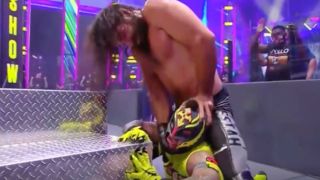 Seth Rollins tries to remove Rey Mysterio's eye at Extreme Rules 2020