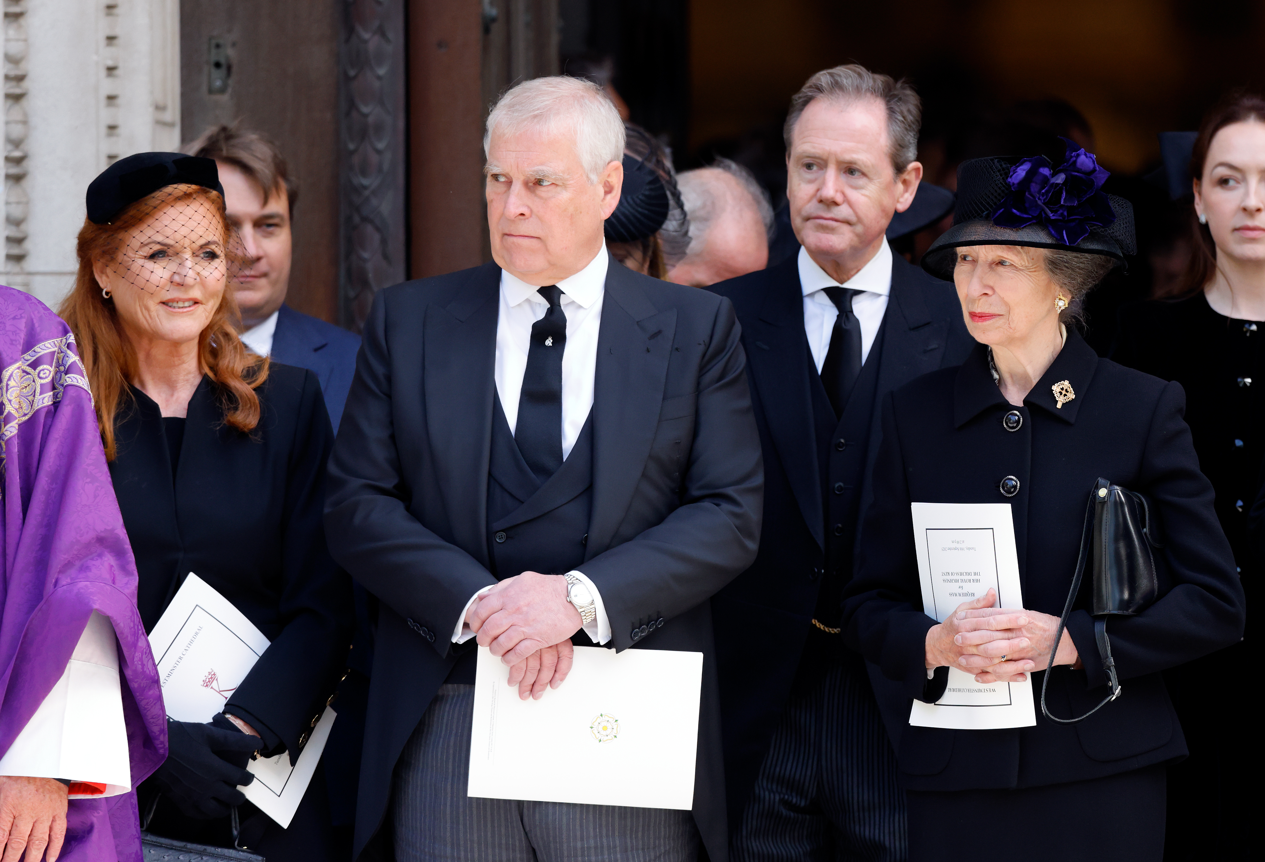 Sarah Ferguson, Prince Andrew and Princess Anne standing in a row at the Duchess of Kent&#039;s funeral