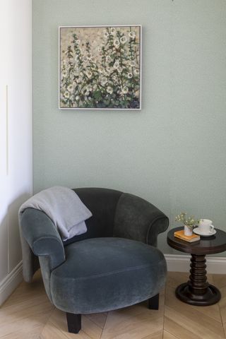 reading nook with floral artwork and love seat by Kitesgrove