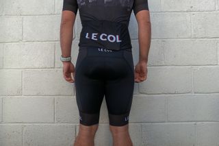 Image shows a rider wearing the Le Col Pro Indoor Training Shorts