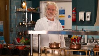 Stu Carpenter wearing chef whites in the Speed Daal kitchen.