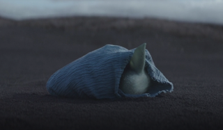 the mandalorian baby yoda wrapped in blanket