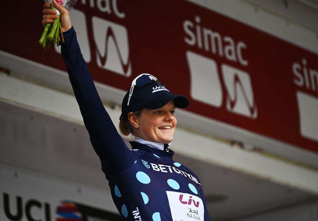 ASSEN NETHERLANDS OCTOBER 09 Jeanne Korevaar of The Netherlands and Team Liv AlUla Jayco celebrates at podium as Polka dot Mountain Jersey during the 26th Simac Ladies Tour 2024 Stage 2 a 1548km stage from Coevorden to Assen on October 09 2024 in Assen Netherlands Photo by Luc ClaessenGetty Images